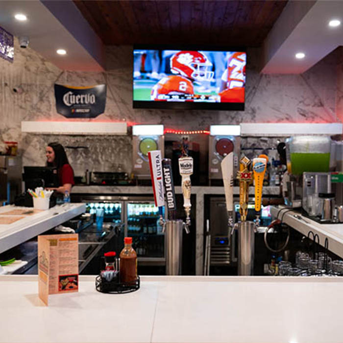 The full bar with TV screens